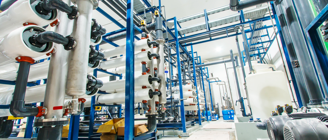interior shot of a filtration plant with blue and white piping