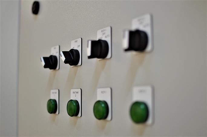 Siemens pushbuttons, indicator lights and switches on an industrial control panel